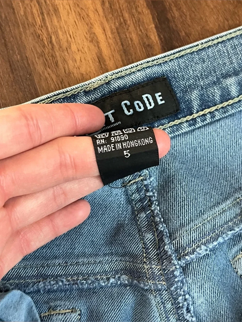 Vintage Y2K Street Code jeans with distressed star patch details